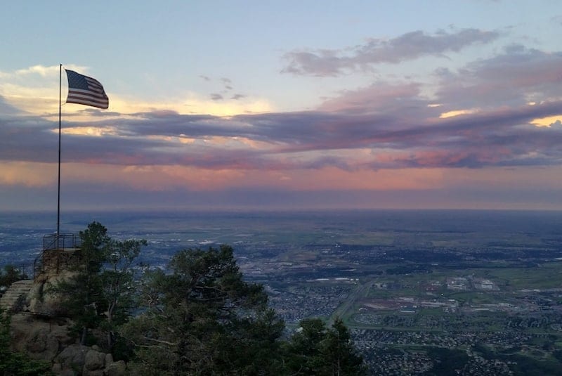 The U.S. flag at The Broadmoor's Cloud Camp - a luxury property in the wilderness 9,200 feet above Colorado Springs, Colorado. Photo by Kara Williams at The Vacation Gals.