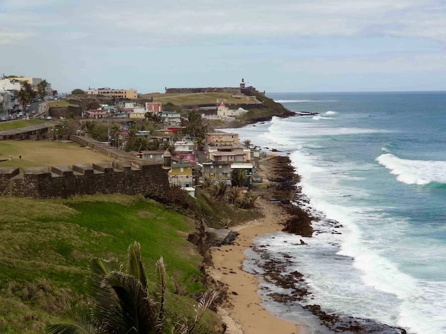 Traveling abroad can be prohibitively expensive but if you want to stretch your dollars and make the most of your vacation, check out these surprisingly affordable international spots including San Juan in Puerto Rico. This photo captures the view of San Juan from atop San Cristobal, photo by Elaine Schoch.