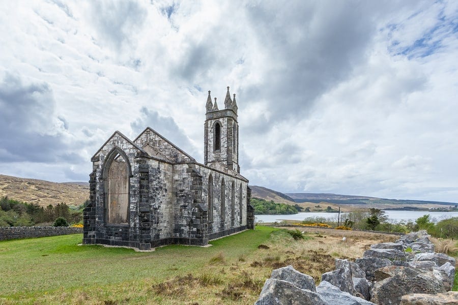 Traveling abroad can be prohibitively expensive but if you want to stretch your dollars and make the most of your vacation, check out these surprisingly affordable international spots including County Donegal in Ireland. This photo is of ruins of the Old Church of Dunlewey in County Donegal Ireland.