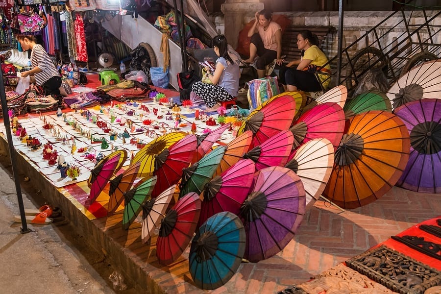 Traveling abroad can be prohibitively expensive but if you want to stretch your dollars and make the most of your vacation, check out these surprisingly affordable international spots including Laos. This photo is of souvenirs beig sold at a night market in Luang Prabang Laos