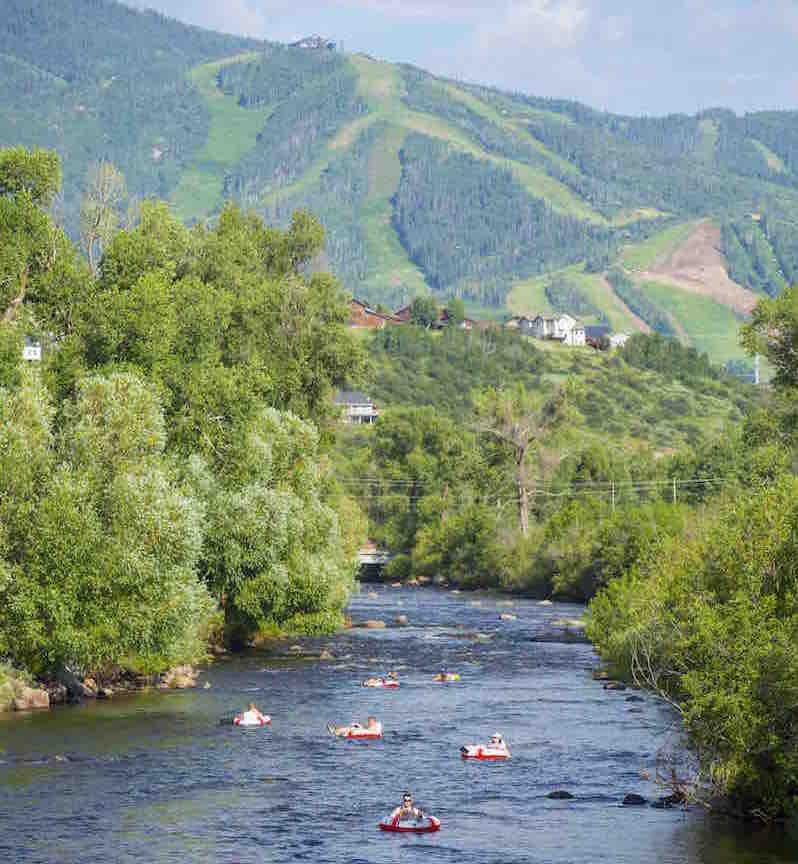 Things to do in Steamboat Springs with Kids - tubing down the Yampa River. Click through for more summer and winter activities in Steamboat Springs.