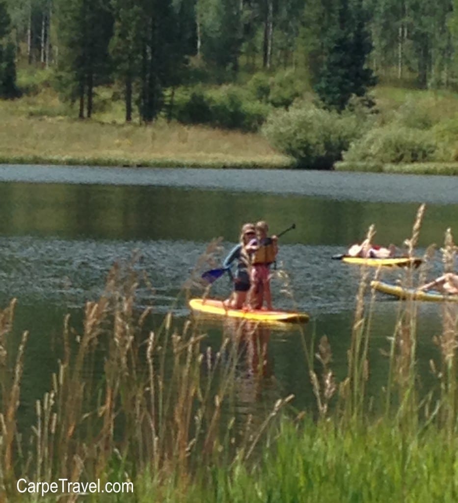 Things to do in Steamboat Springs with Kids - Paddleboarding at Pearl Lake. Click through for more summer and winter activities in Steamboat Springs.